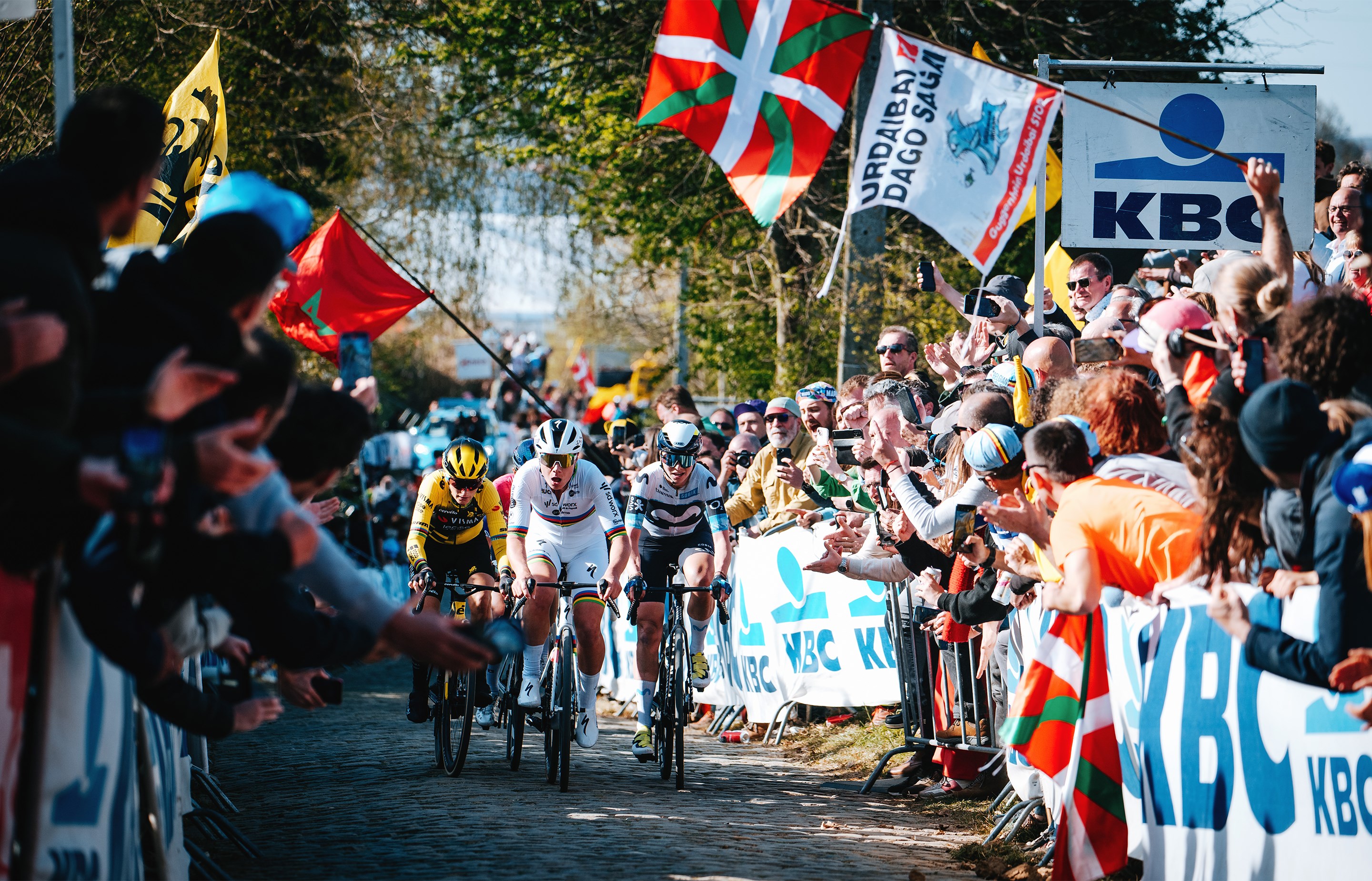 Kopecky, Ferrand-Prévot and Lippert battle up a cobbled climb in the Tour of Flanders.