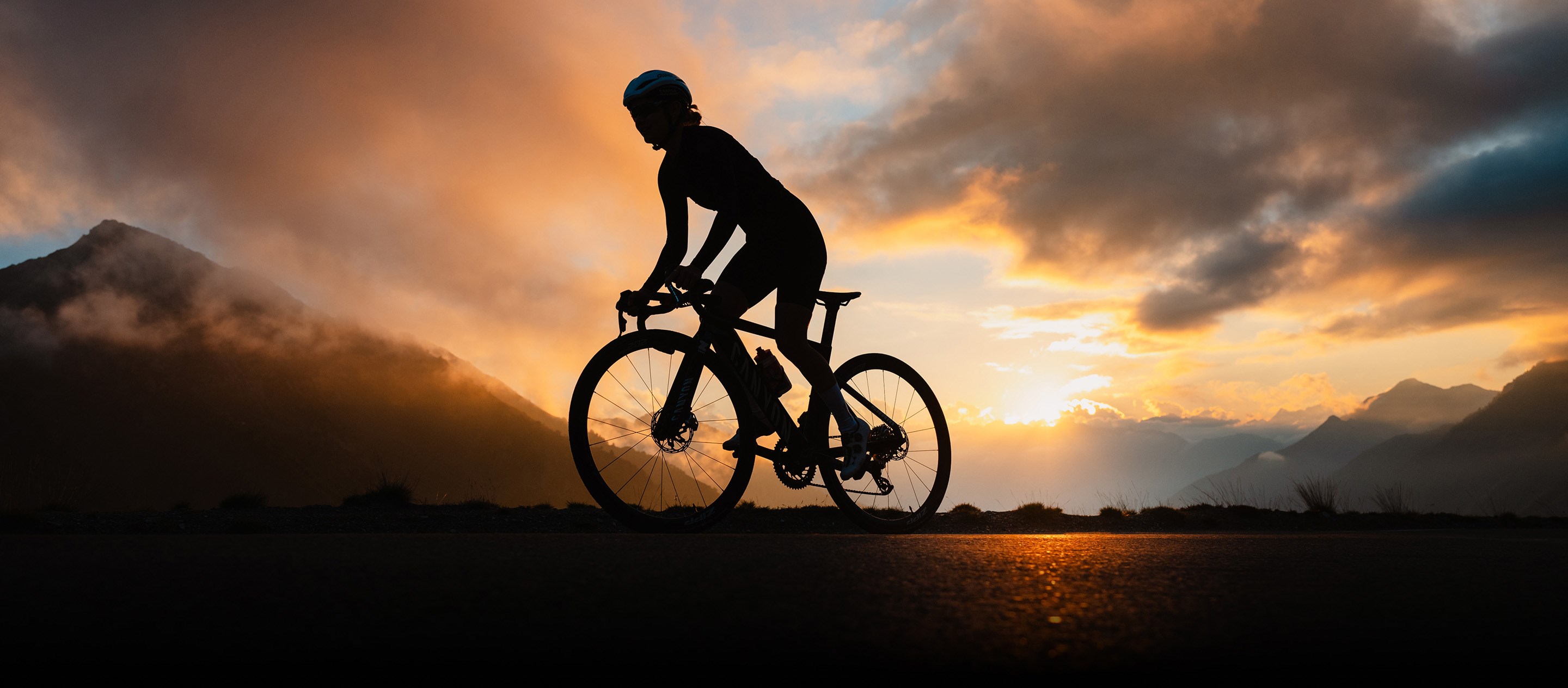 silhouette of rider on Zipp 202 NSW wheels