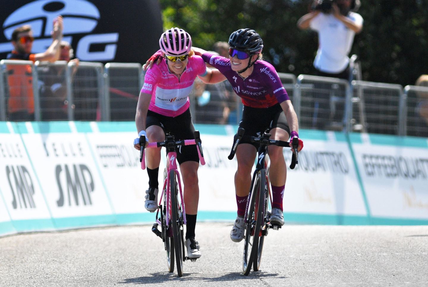 Anna van der Breggen and Demi Vollering as teammates on Team SD Worx crossing the finish line togather.