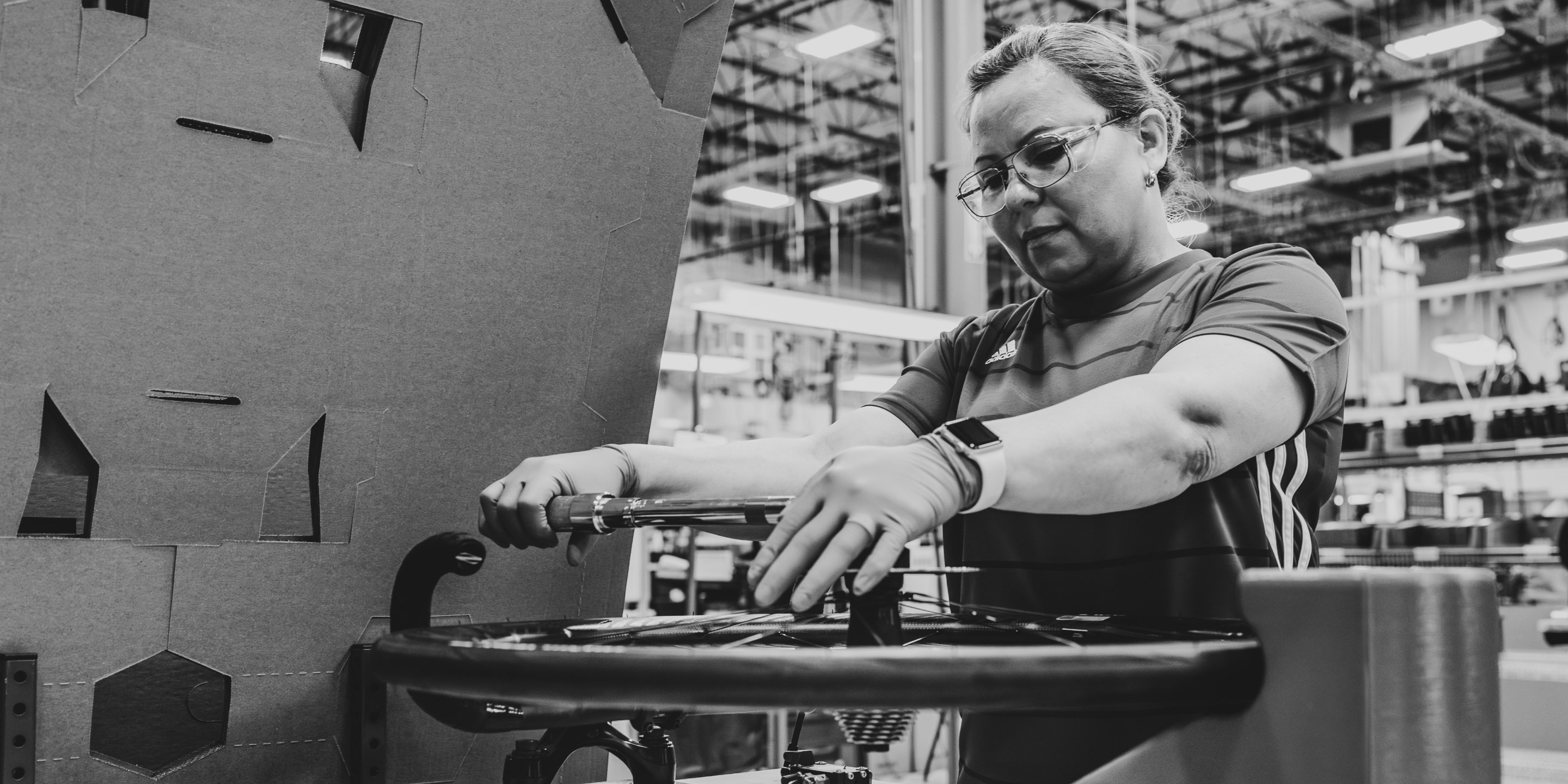Black and White image of Zipp wheel being assembled