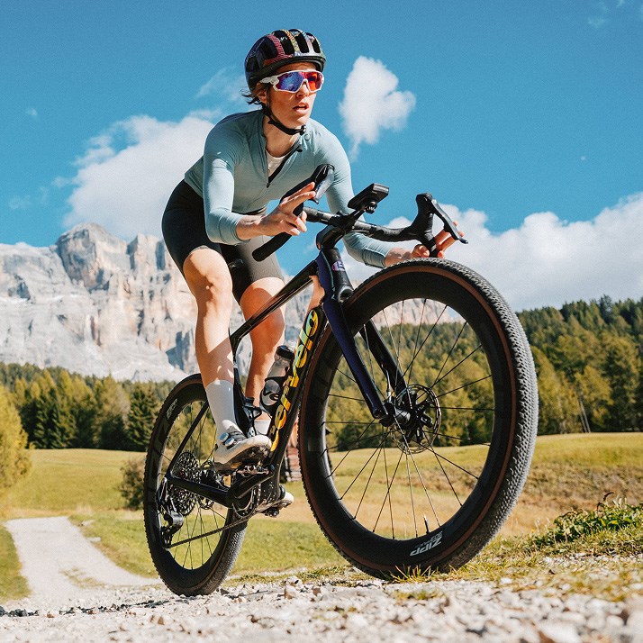 image of 303 XPLR wheel kicking up dirt on trail.