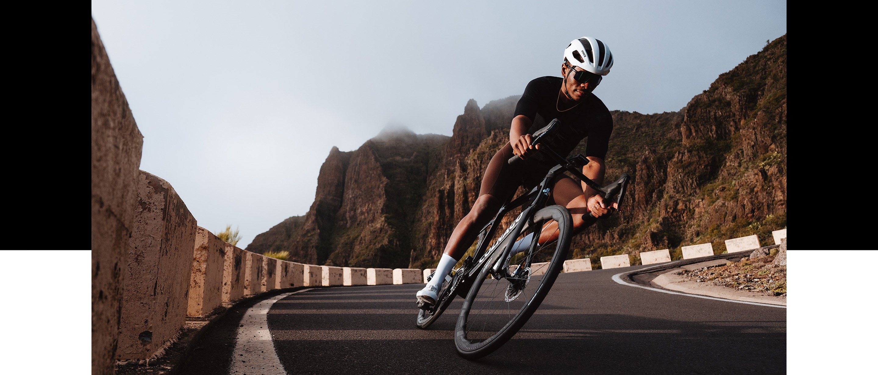 Rider on Zipp 353 NSW wheels ripping down canyon road