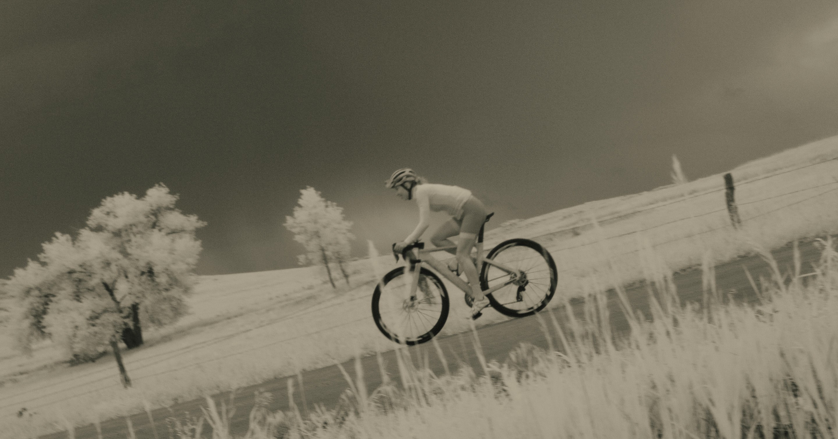 Kasia Niewiadoma pedaling her SRAM equipped Canyon road bike through the Polish countryside