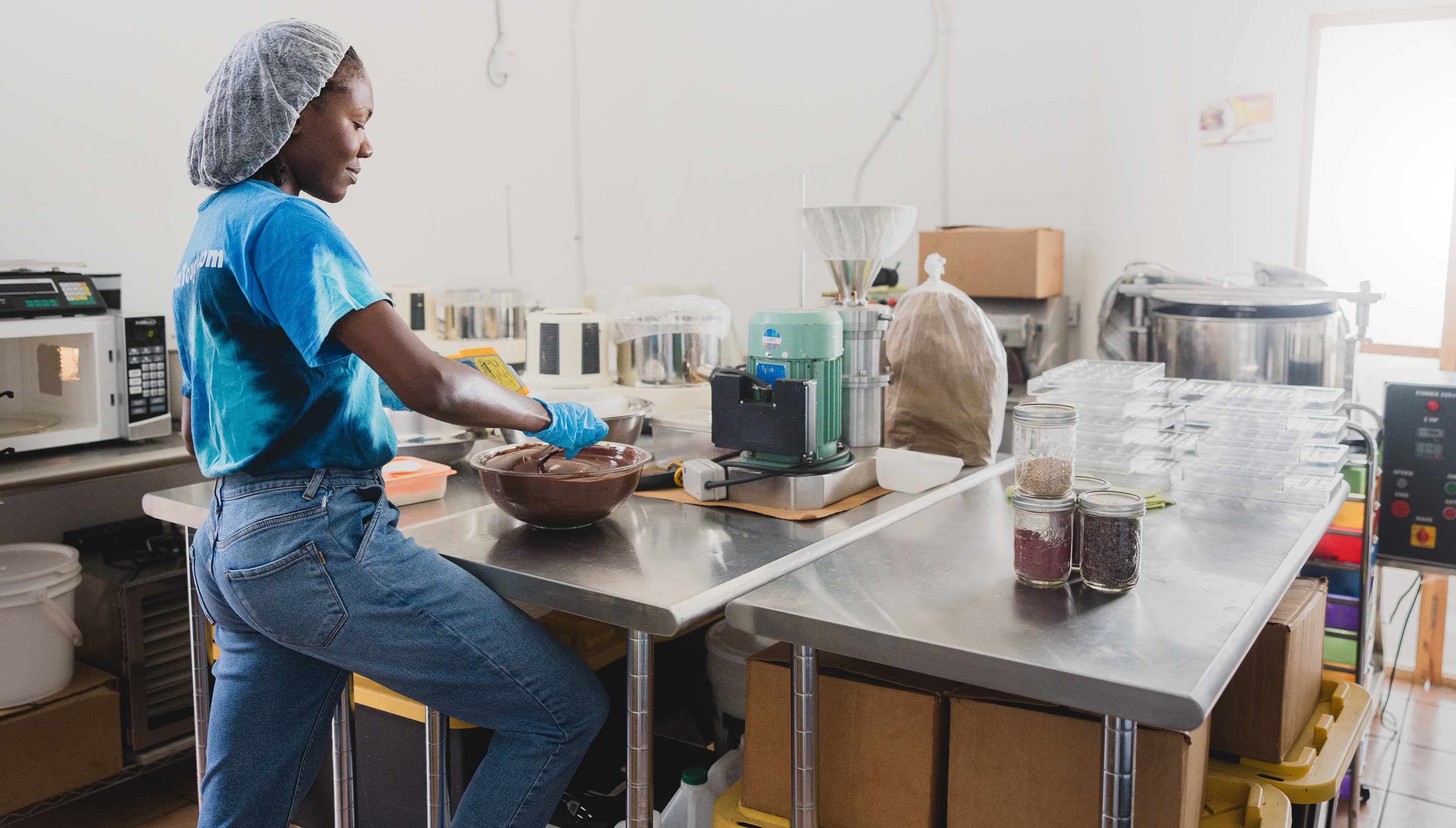 Professional cyclist Llori Sharpe making chocolate in Jamaica