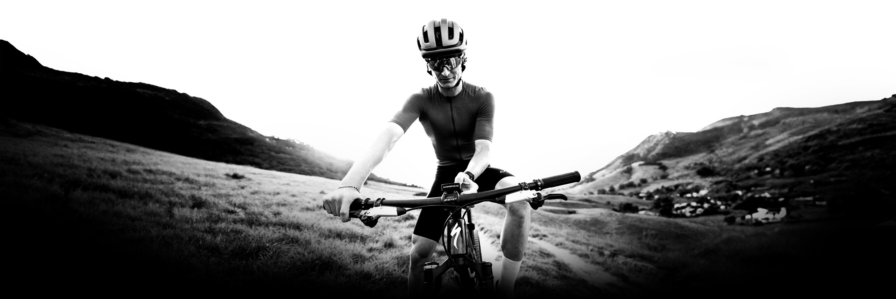 Rider adjusting RockShox Flight Attendant suspension on the fly with Karoo