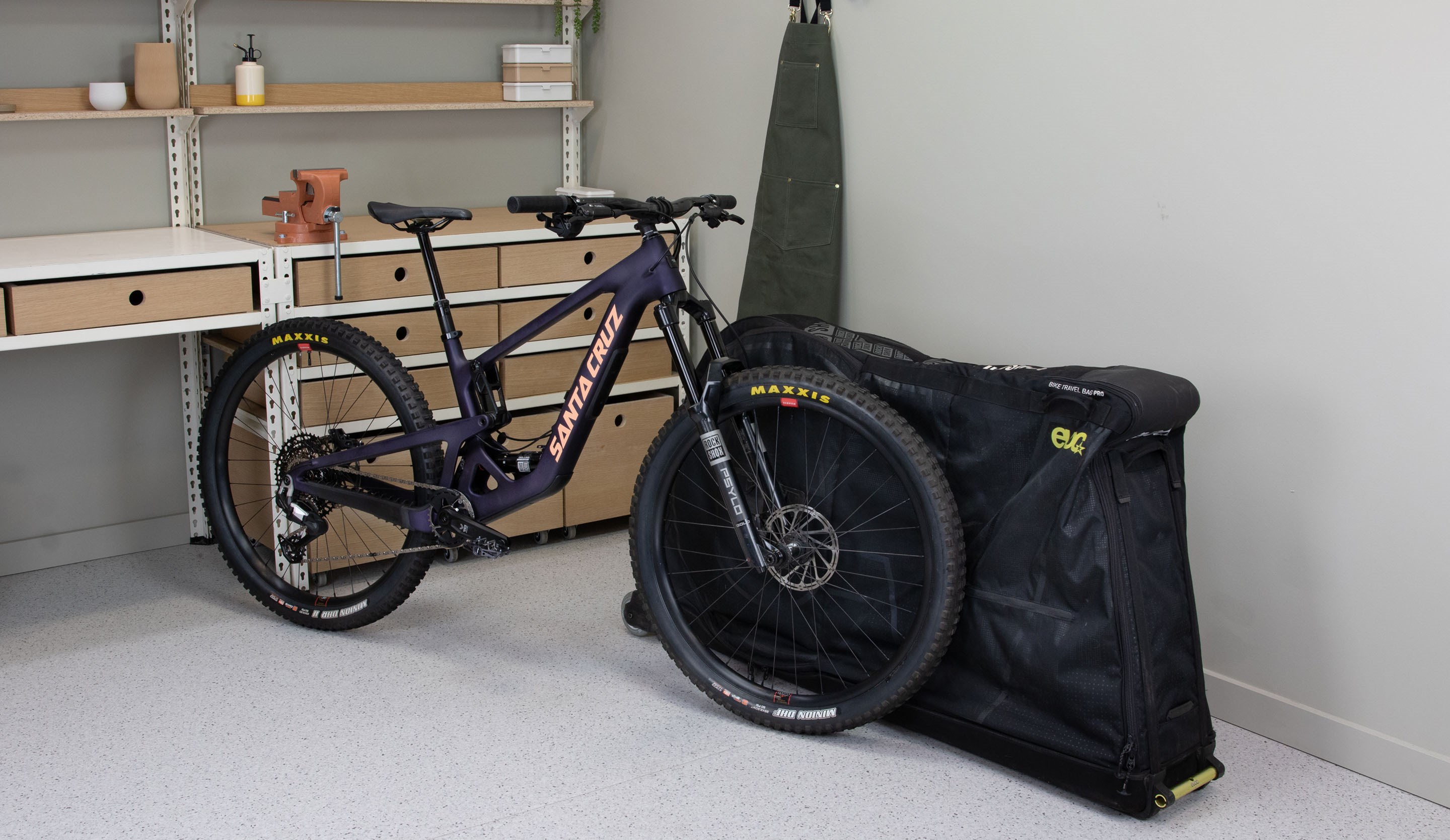 Fully assembled Santacruz bike next to a bike bag