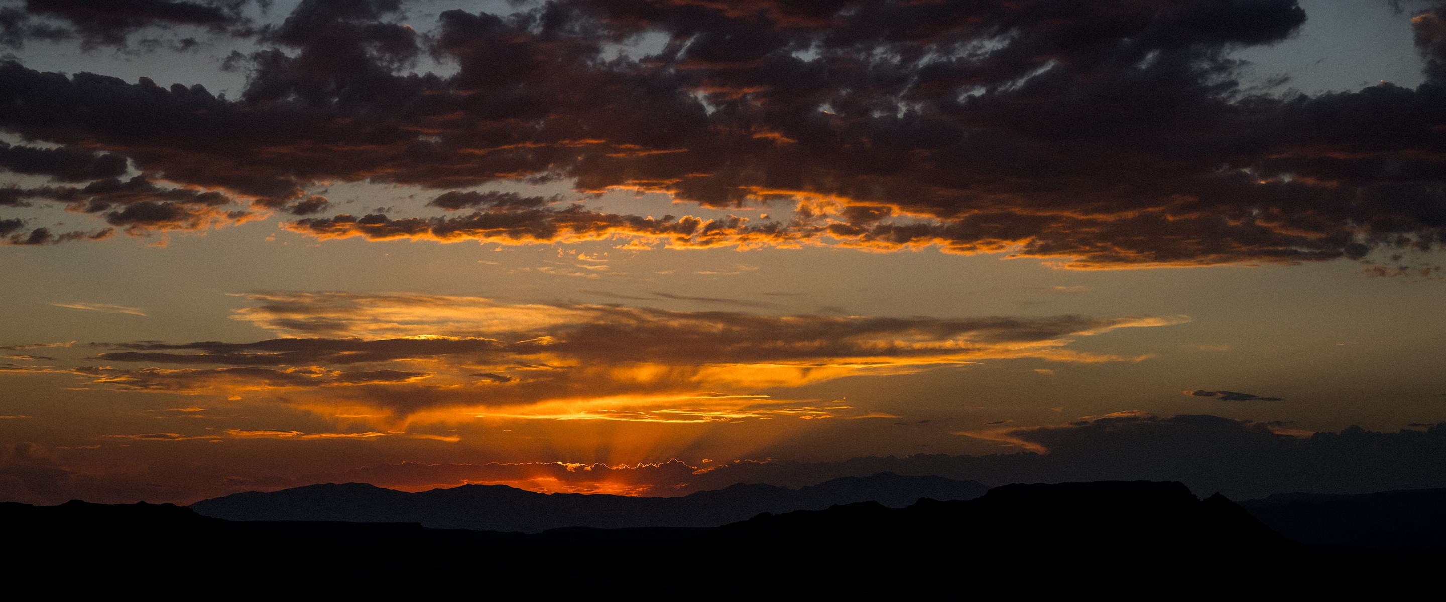 The dawn of a new chapter at Red Bull Rampage metaphorically represented by a beautiful sunrise.