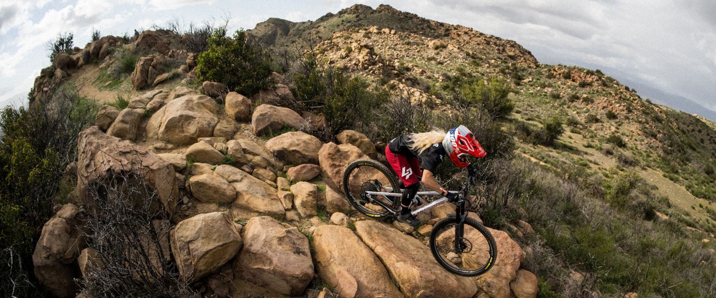 Isabeau Courdurier riding a rock garden on a Lapierre Spicy with Super Deluxe Ultimate.
