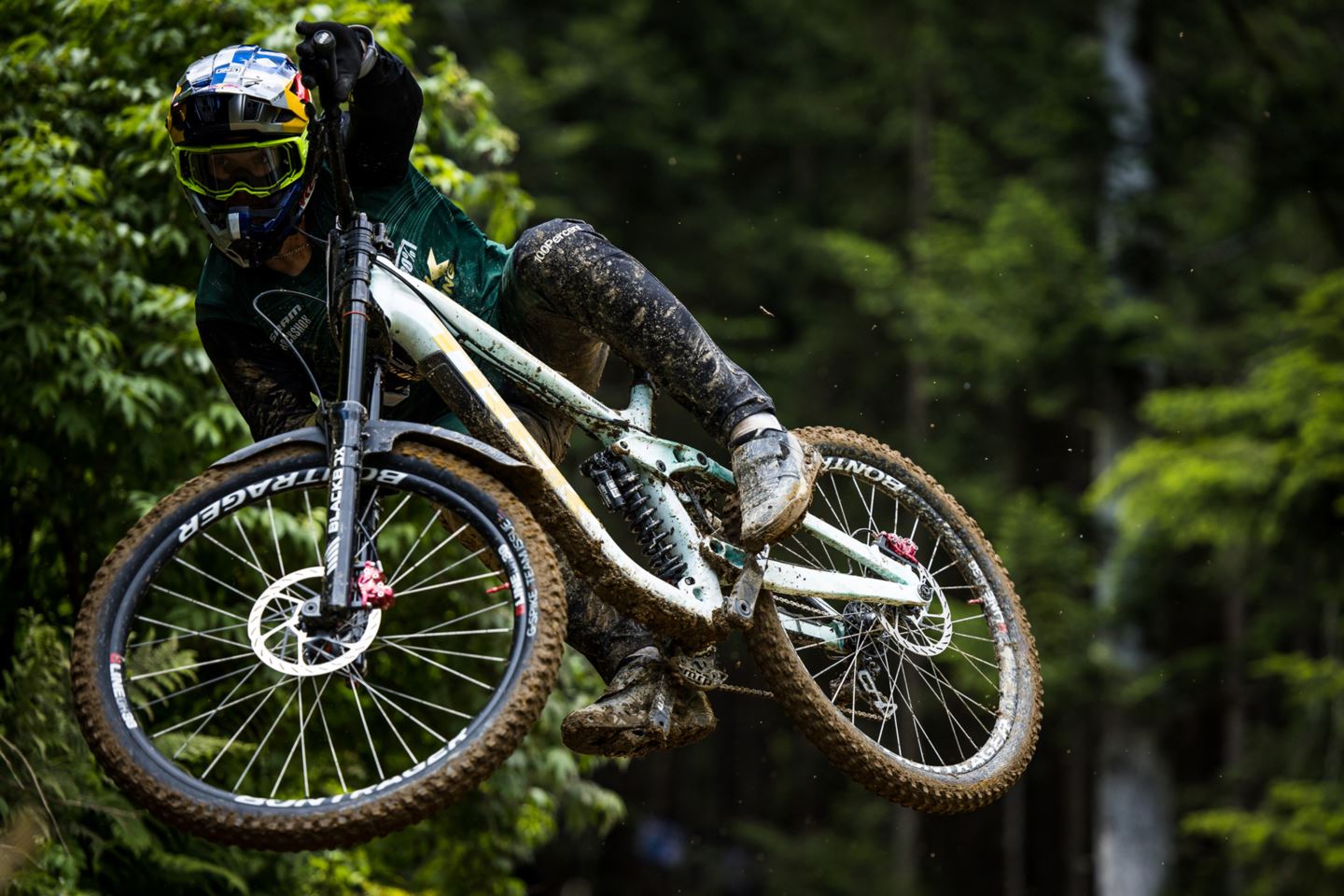 World Cup DH racer Kade Edwards jumping.