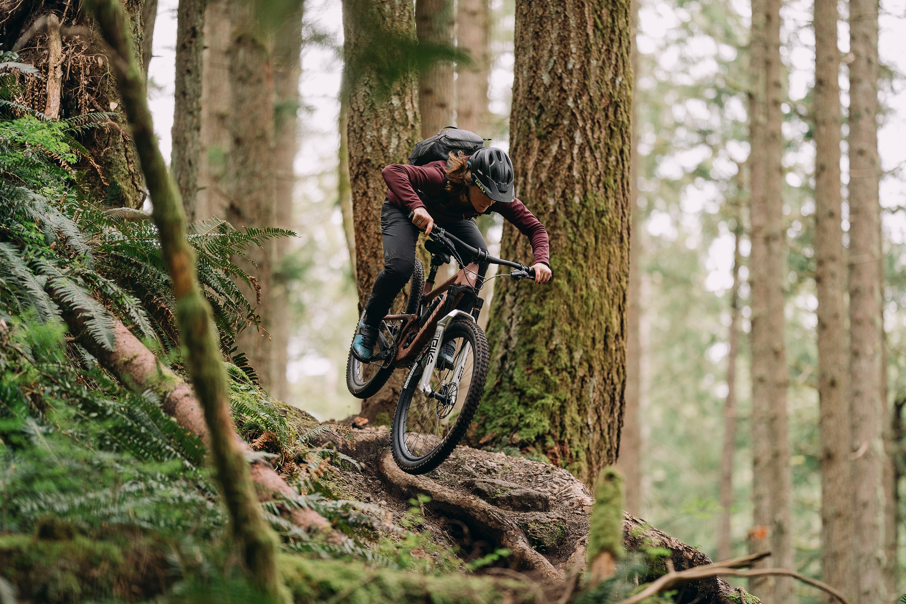 Britt Phelan flying over a root on a Juliana Joplin.