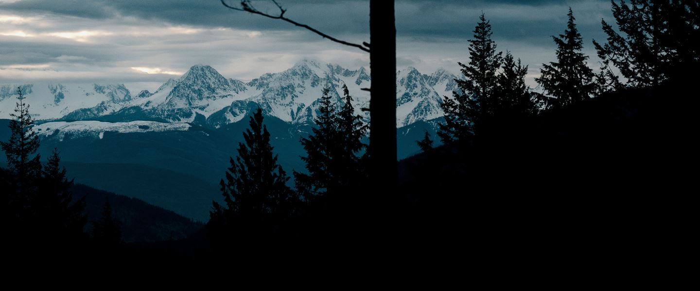 A mountainscape view of the Cascades at sunset.