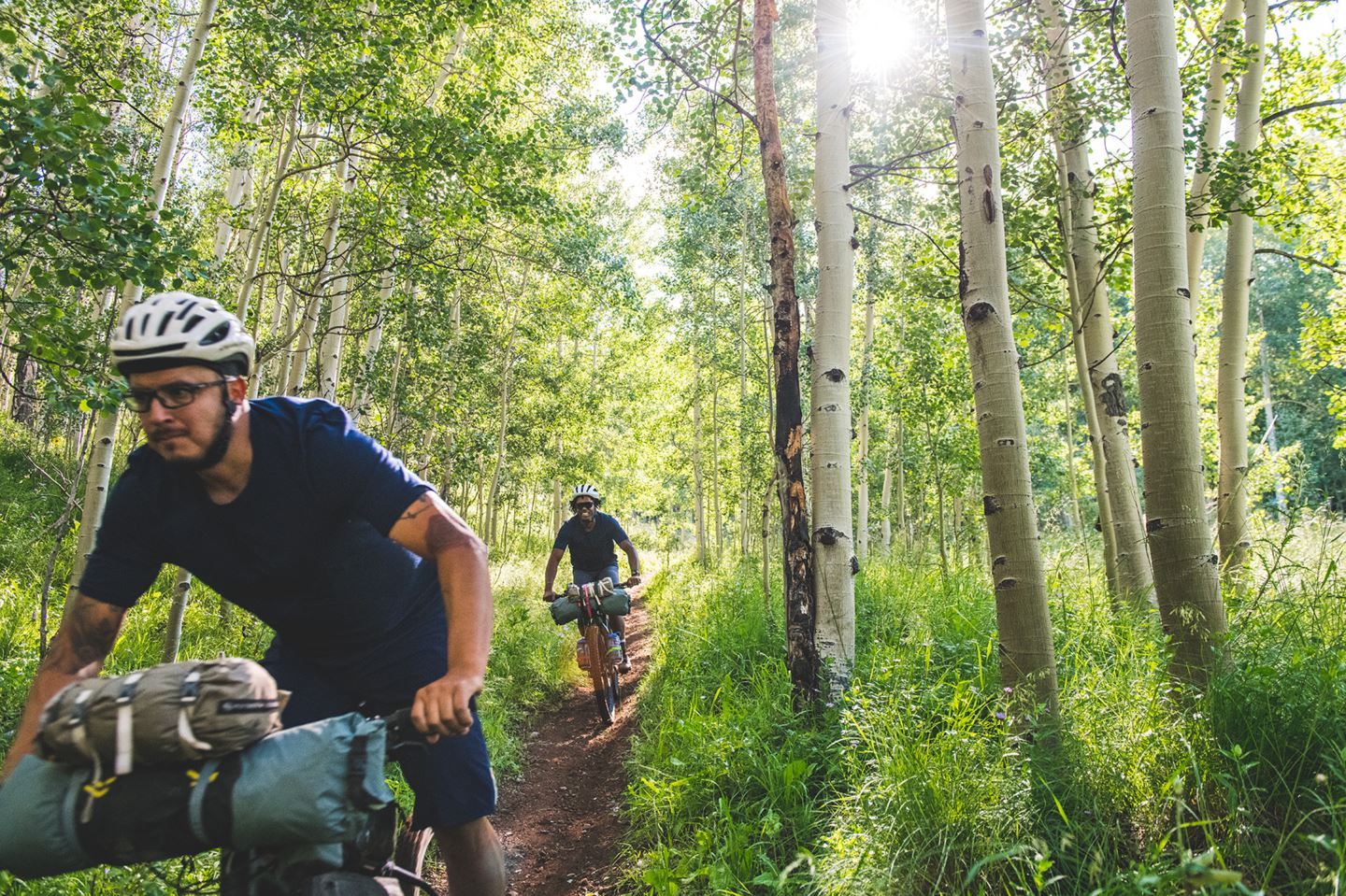 Eric leading Evan through the aspens