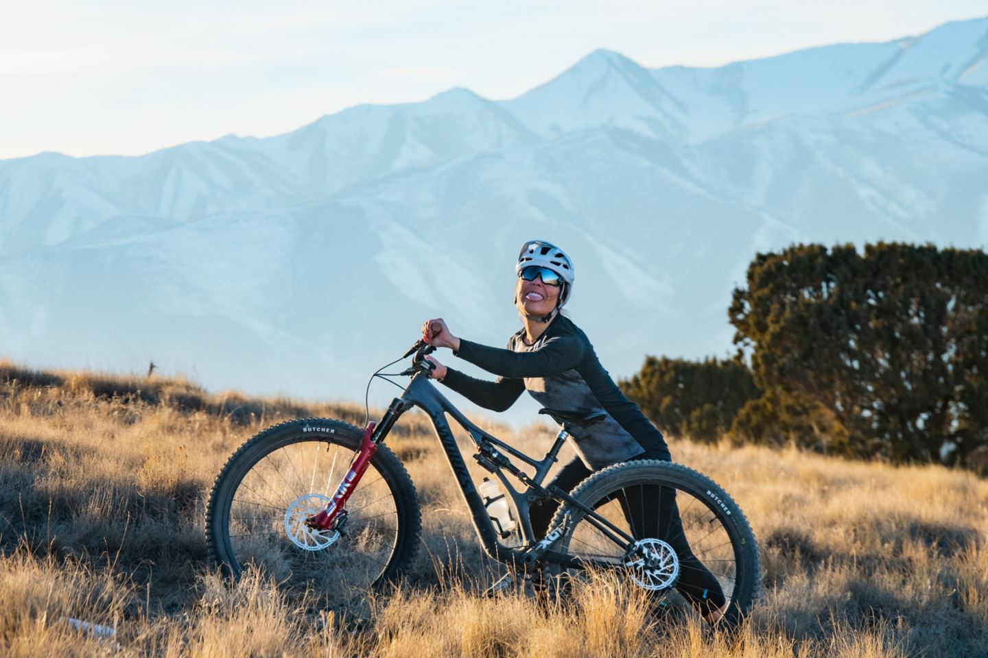 Garrin Evans pushing her bike uphill.