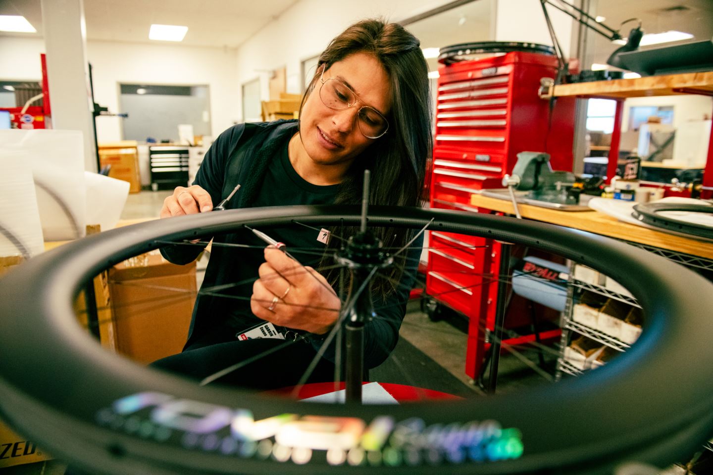 Garrin Evans building a Roval Wheel at Specialized Bicycles.