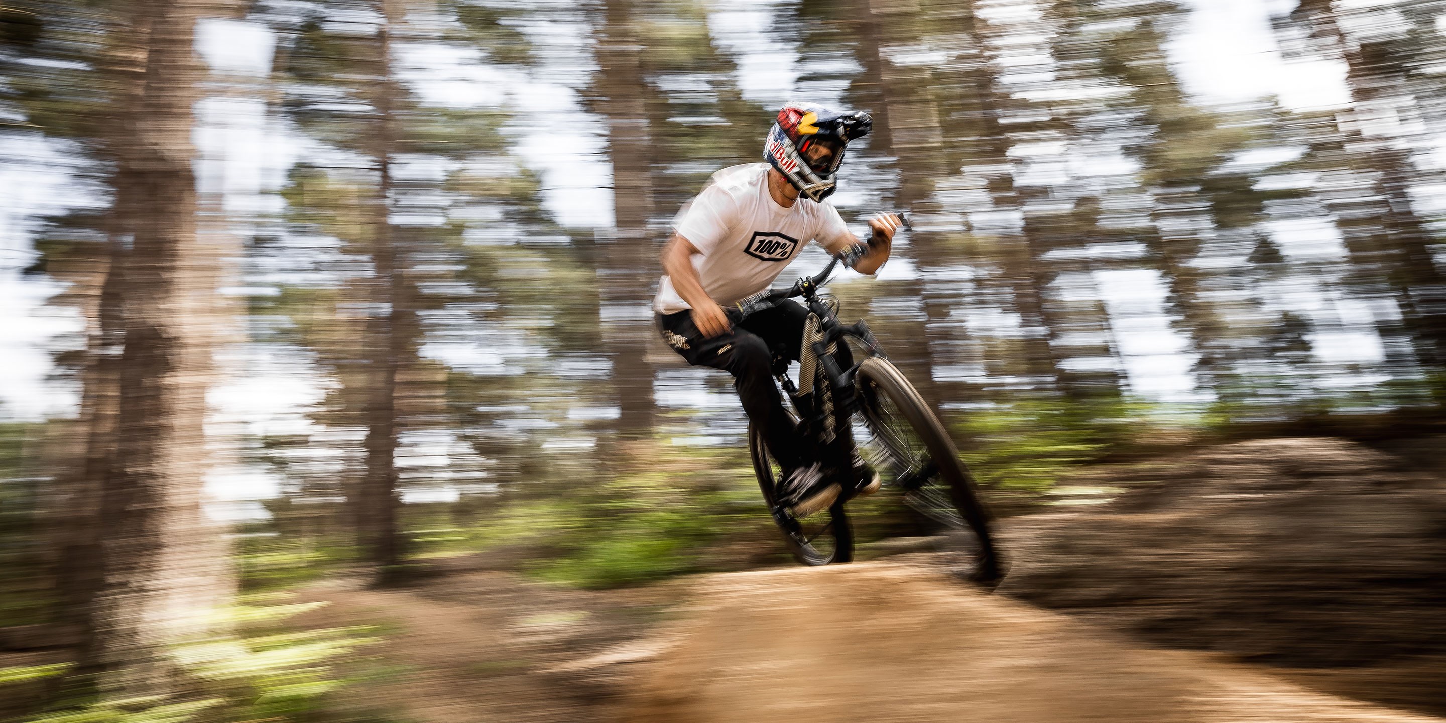 A pano photo of Kade Edwards jumping his bike looking very fast.