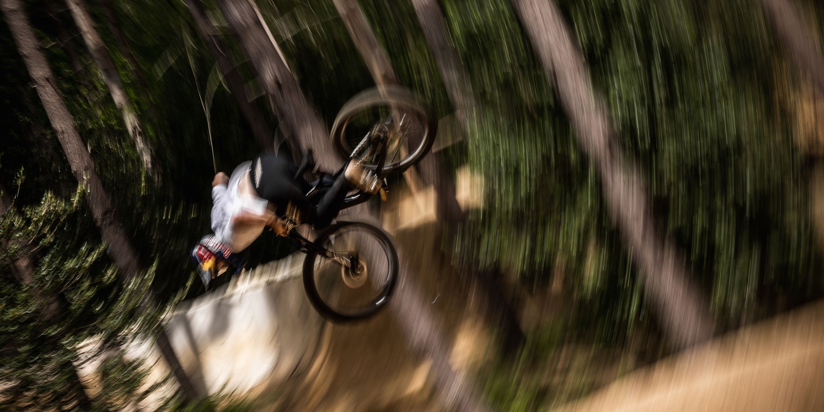 A blurry photo of Kade doing a trick in the air.