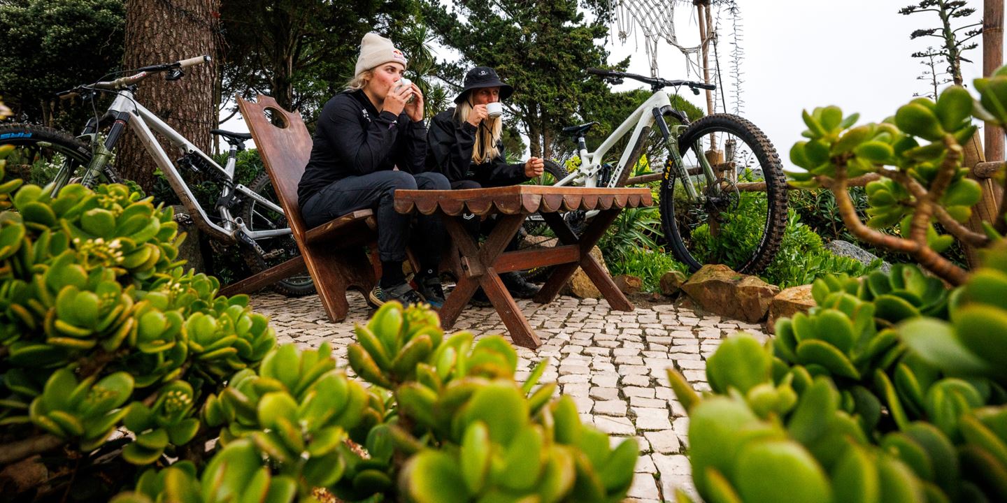 Vali Höll and Cécile Ravanel enjoying a coffee in a succulent garden.