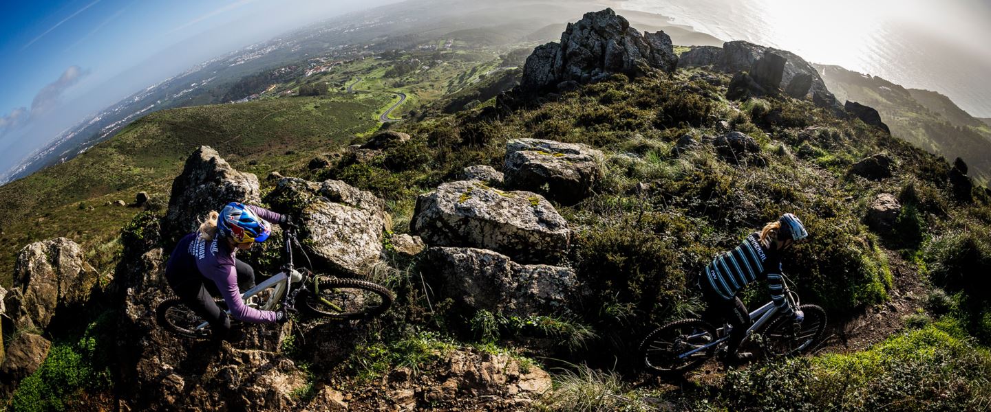 Fish eye view of Vali Höll and Cecile Ravanel riding by the coastline of Portugal.