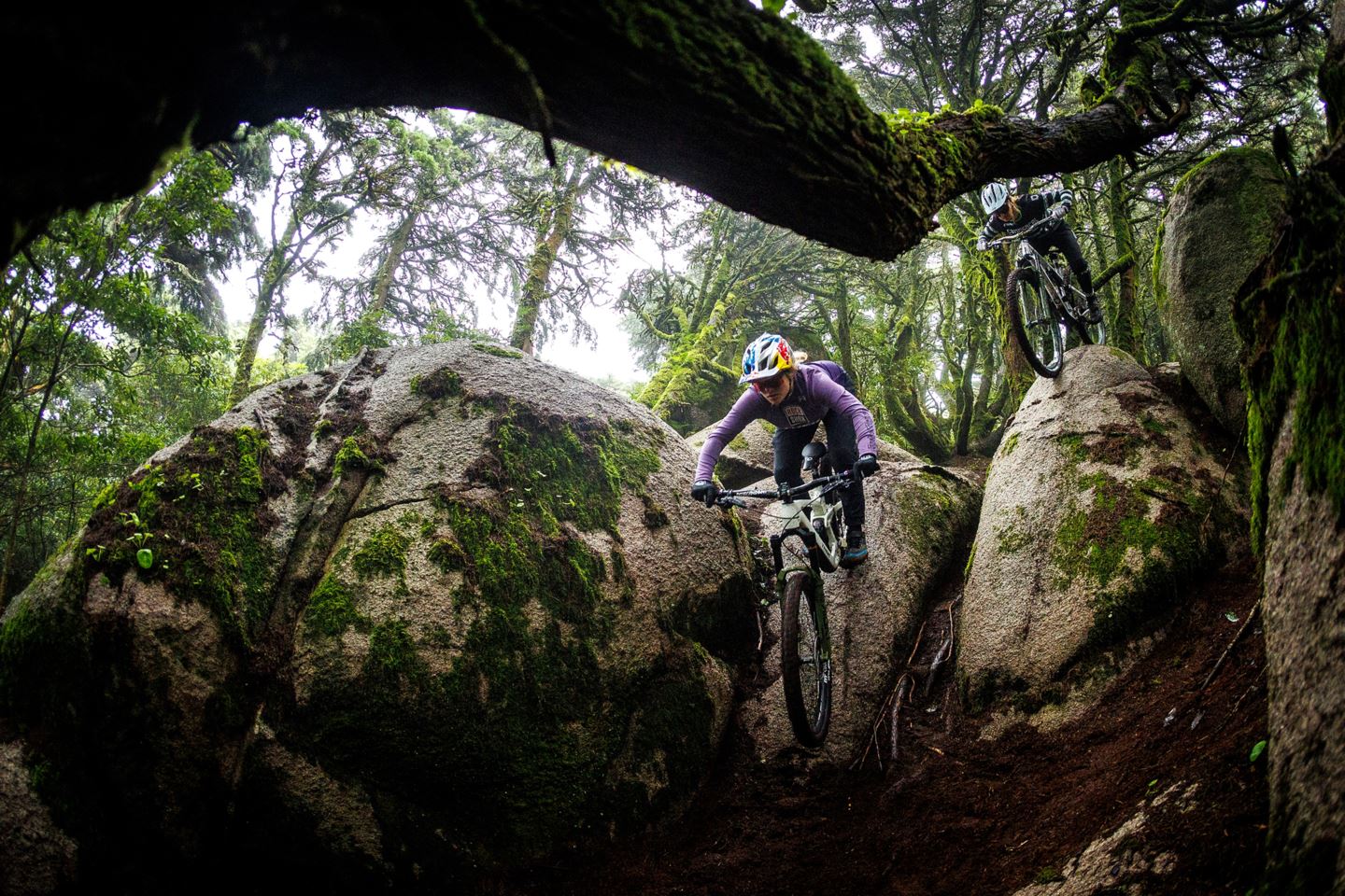 Vali Höll and Cécile Ravanel riding a big rock roll.