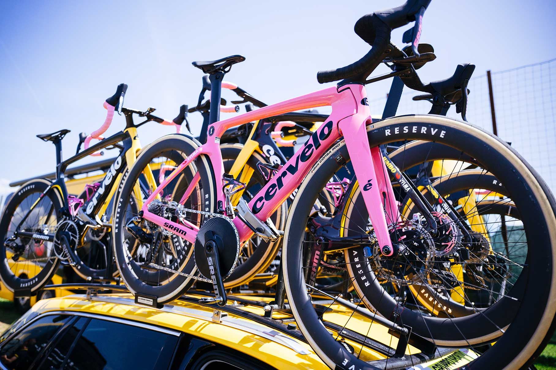 Roglic's bike on the roof of a Jumbo-Visma team car