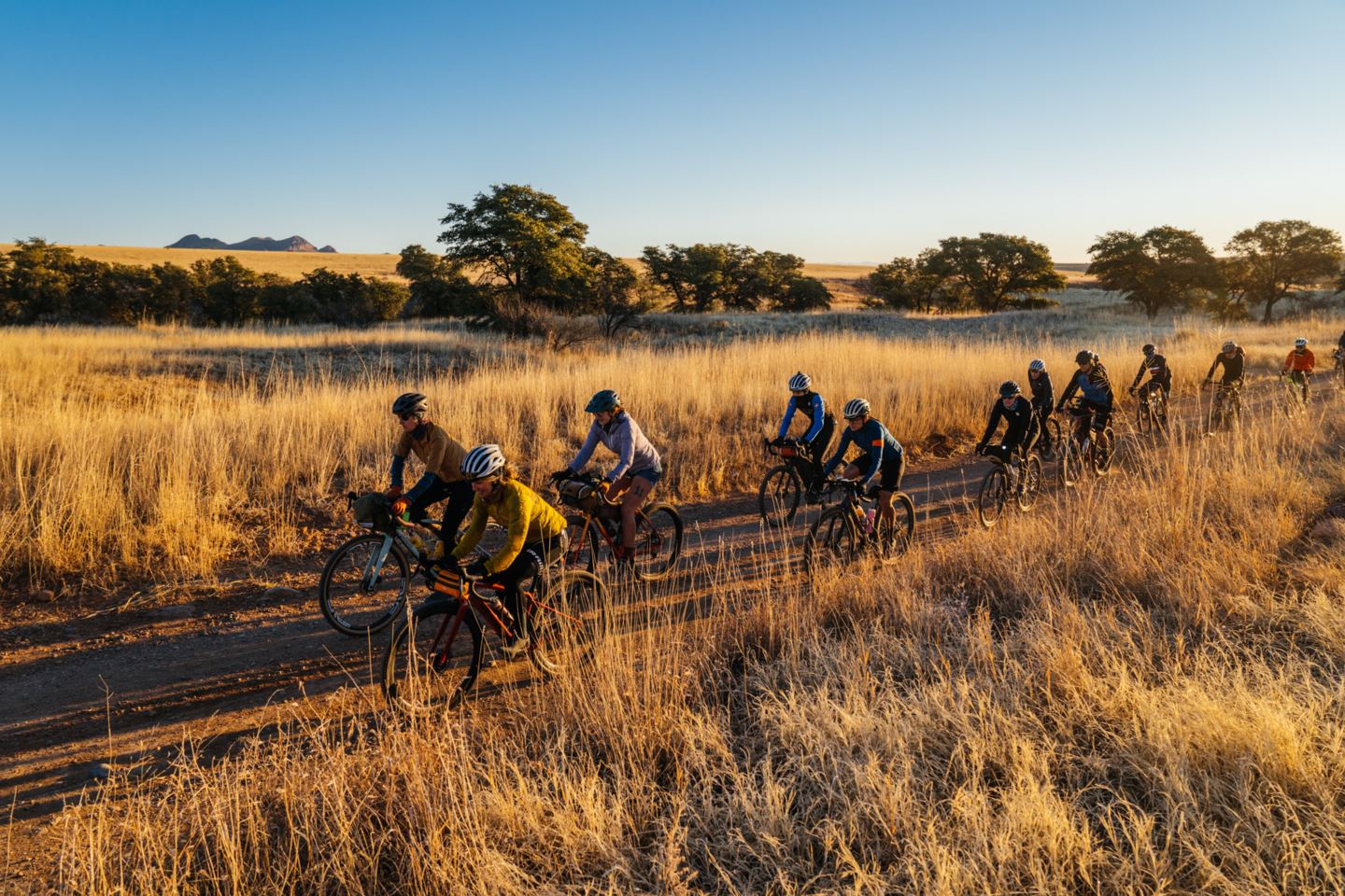 Sarah Sturm and Lael Wilcox lead the 135-mile riders at dawn.