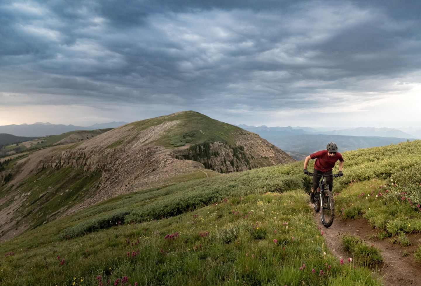 Rider on singletrack in the mountains