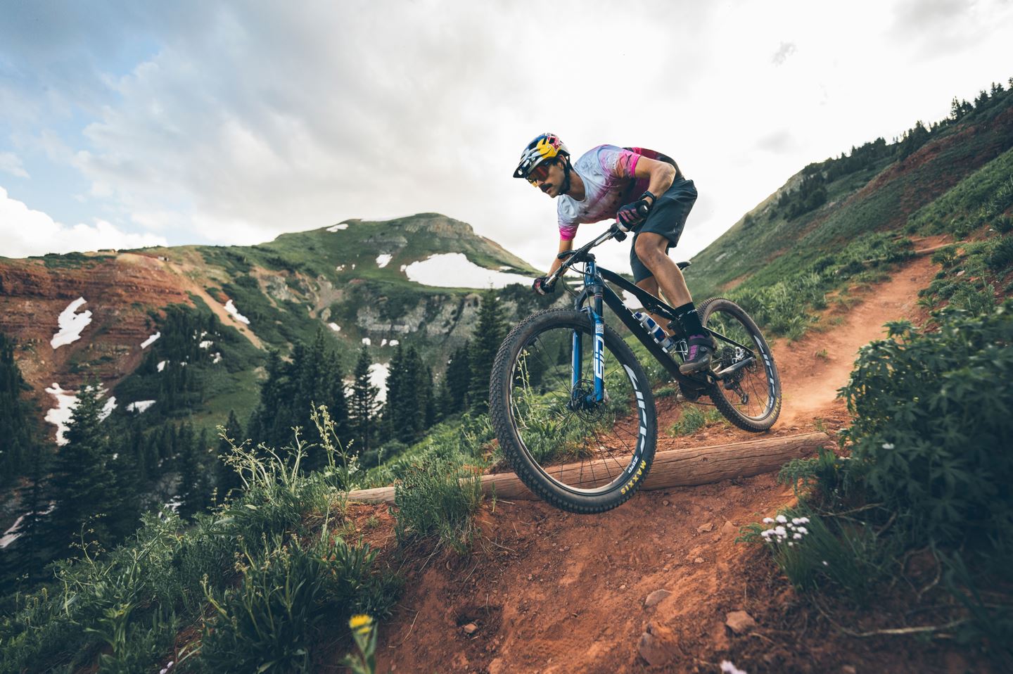 A person rides a bike in the mountains