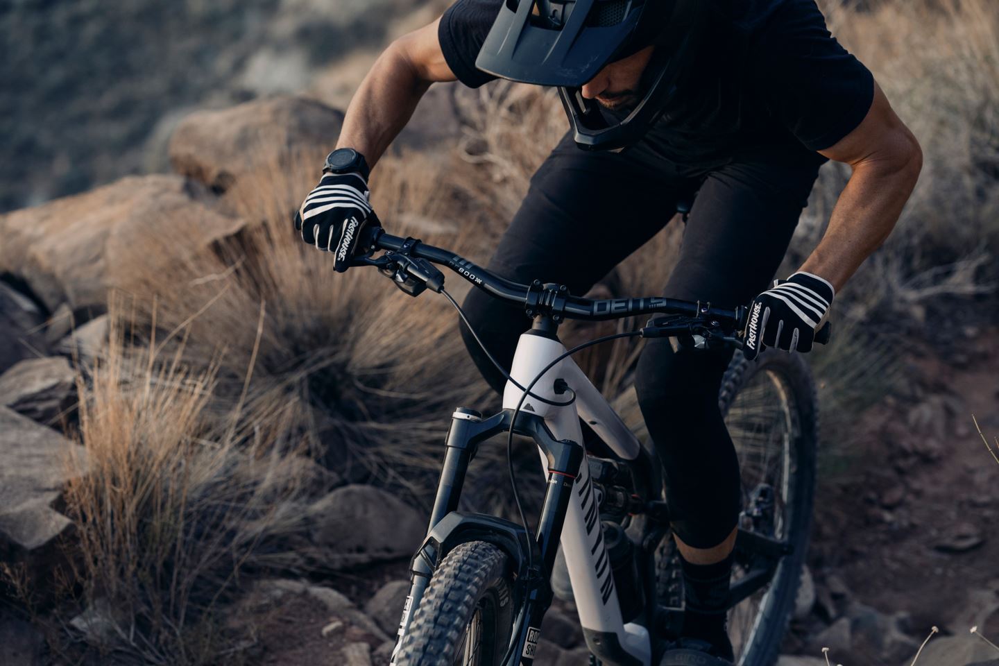 Zoomed in shot of Braydon Bringhurst climbing on his Flight Attendant bike up Grafton Mesa DH.