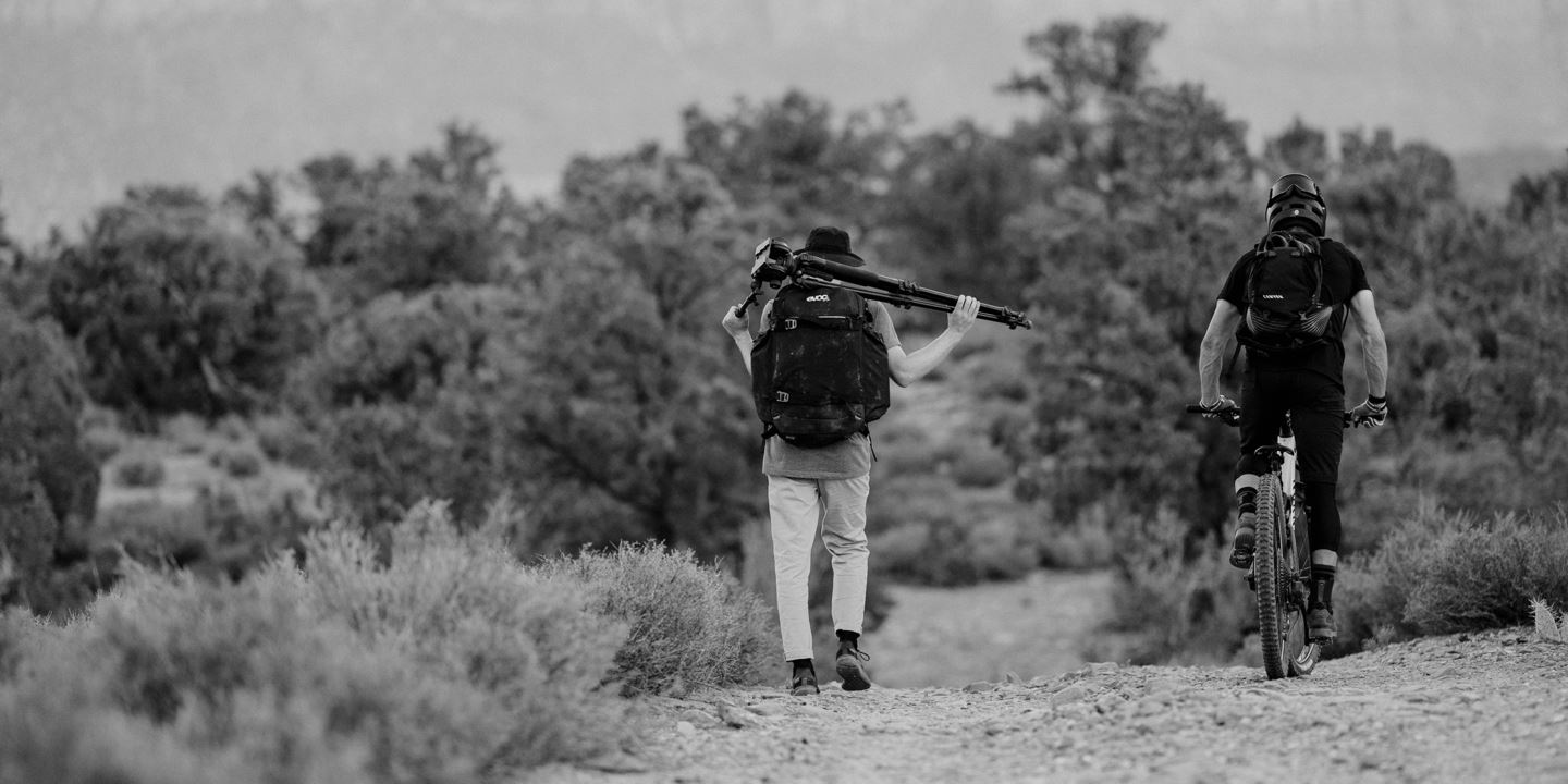 Rider Braydon Bringhurst and cinematographer Tory Powers riding and walking together.