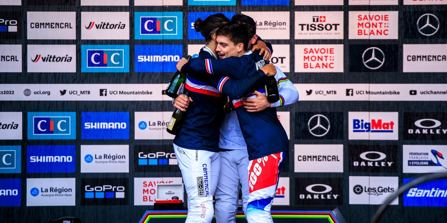 An all French podium for the Elite Men DH hugging.
