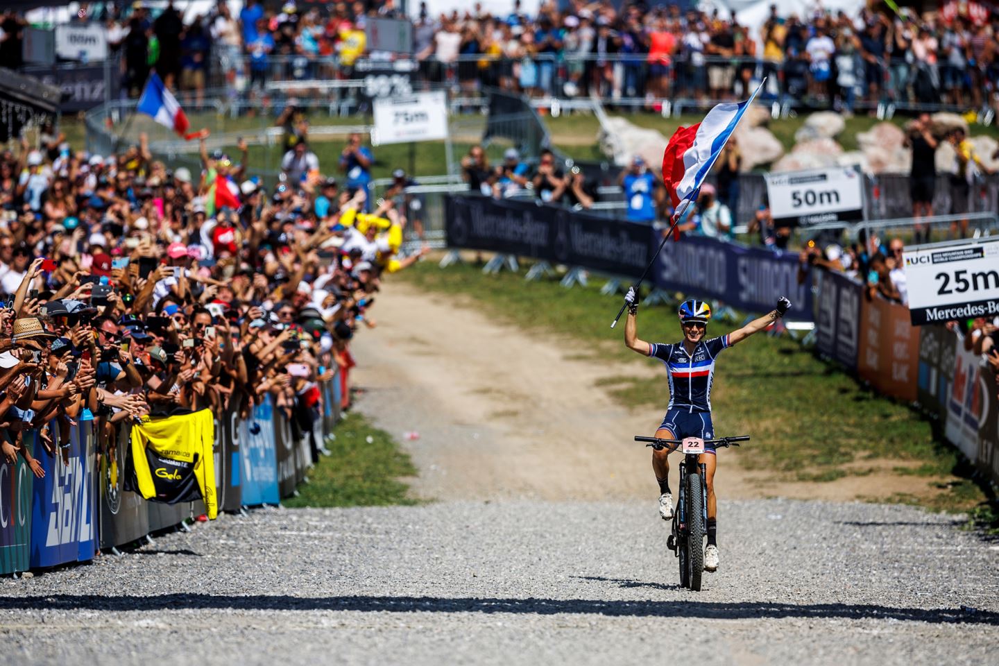 Pauline Ferrand Prévot crosses the finish line in front in front of her French fans.