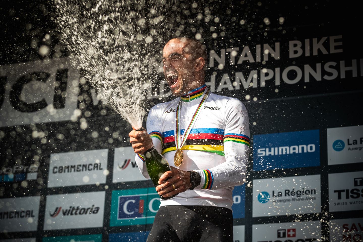 Nino Schurter standing on the podium for his 10th World Championship title.