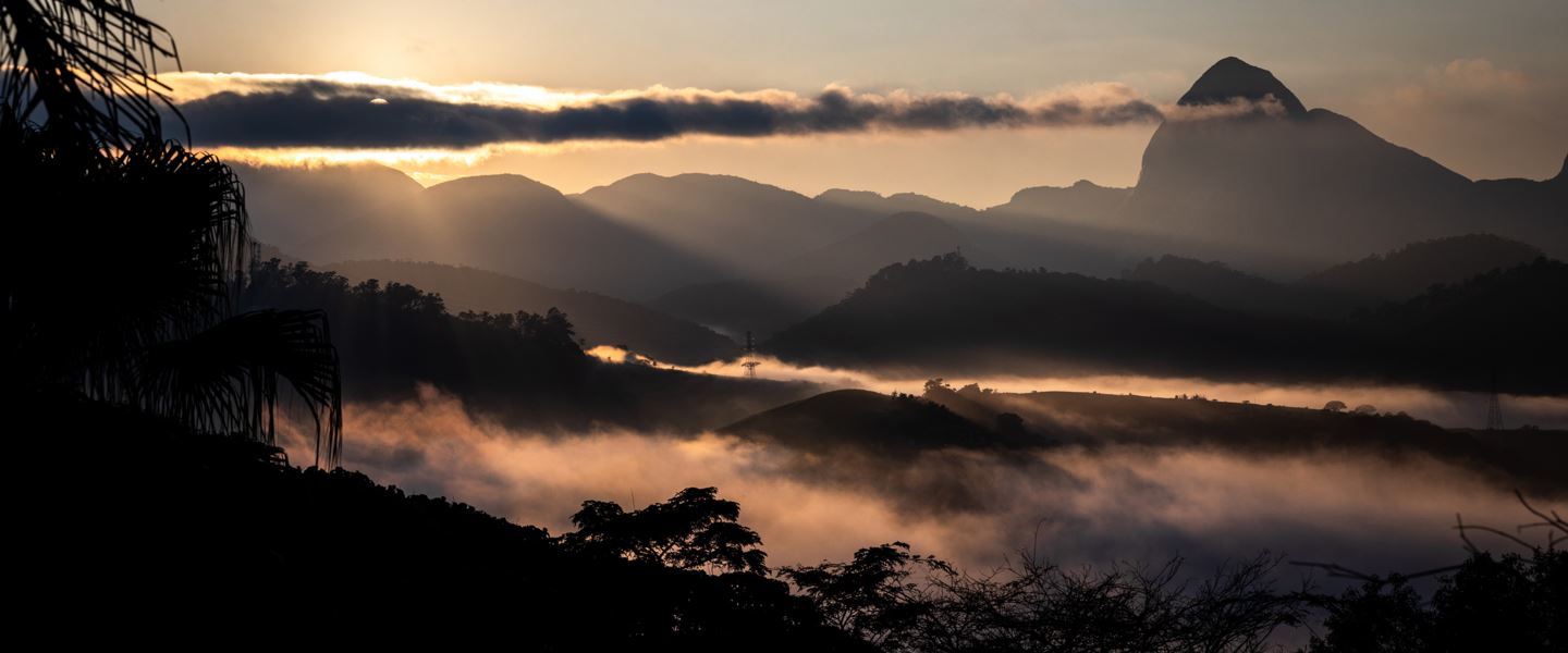 Sunrise silhouette of landscape in Petrópolis, Brazil.