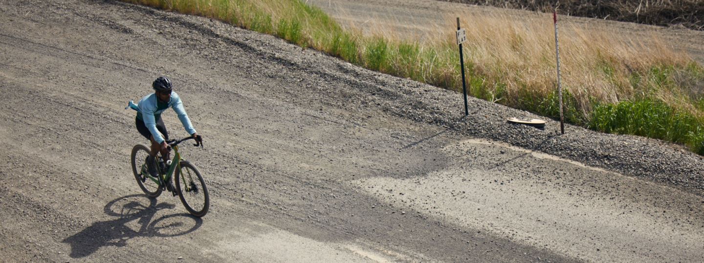 A man rides a Cervelo Aspero with XPLR on a gravel road