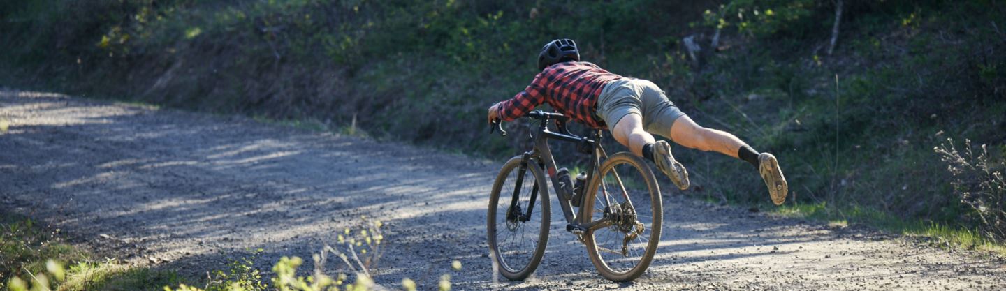 A man rides down a staircase on a Lauf True Grit with XPLR and a RockShox Rudy