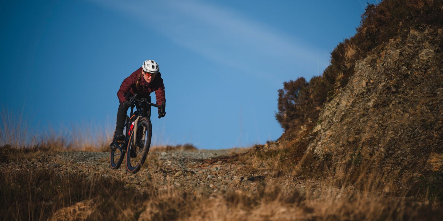 Rachael Walker descending down a rocky road.