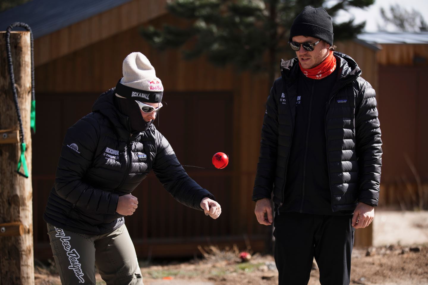 Vali Höll warming up for her race run with a Box a Ball with her trainer watching on..