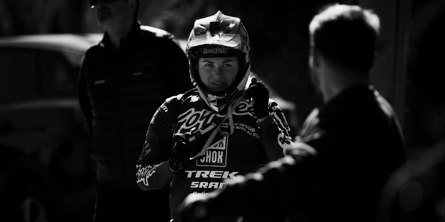 Vali Höll interacting with her mechanic, Mat Gallean, after a testing run.