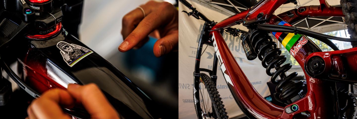 (Left) Vali Höll placing the final touches on the toptube of her bike. (Right) Looking up at Vali's Trek Session with World Champion stripes on the seat tube with RockShox Super Deluxe Coil rear shock in full view.
