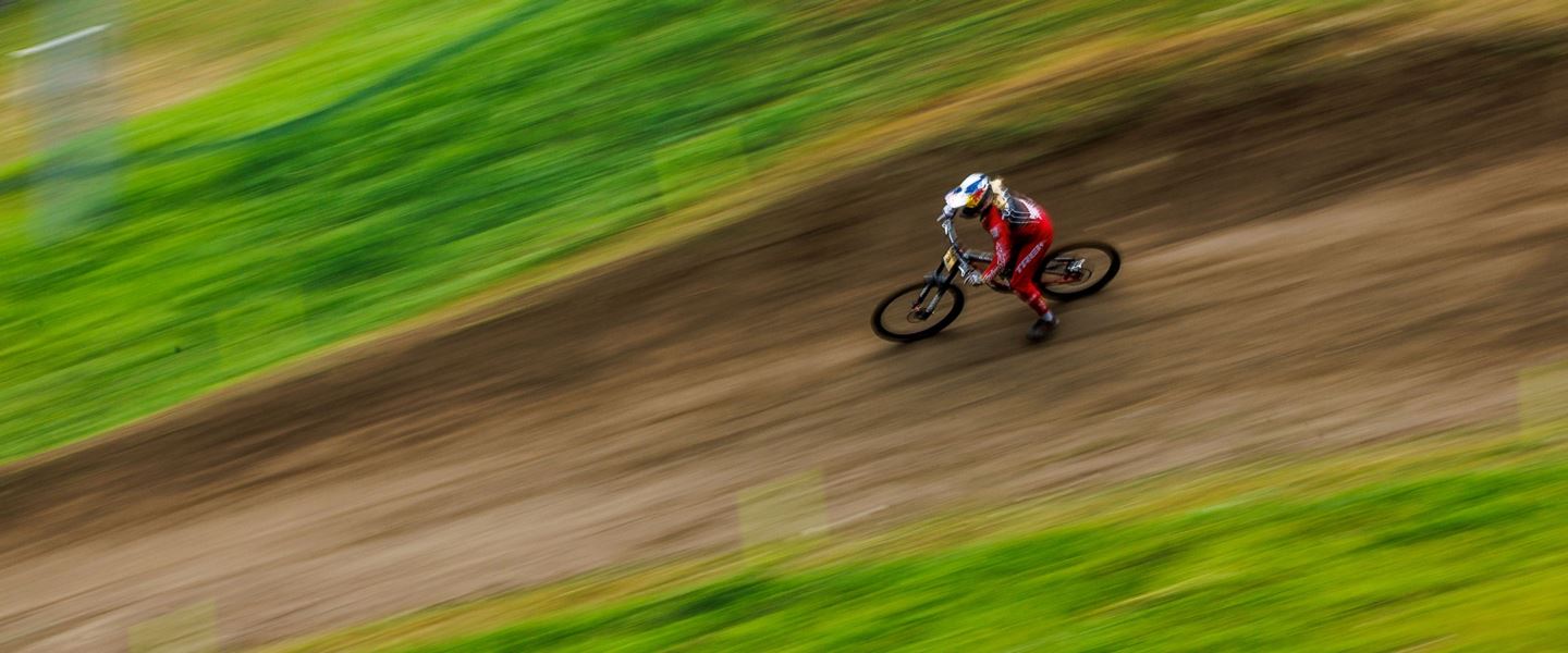 A pan shot looking down at Vali in a practice run.