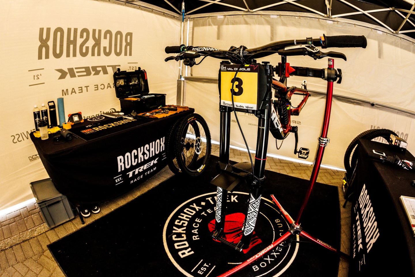 Trek Session in the workstand under the RockShox Trek Race Team tent.