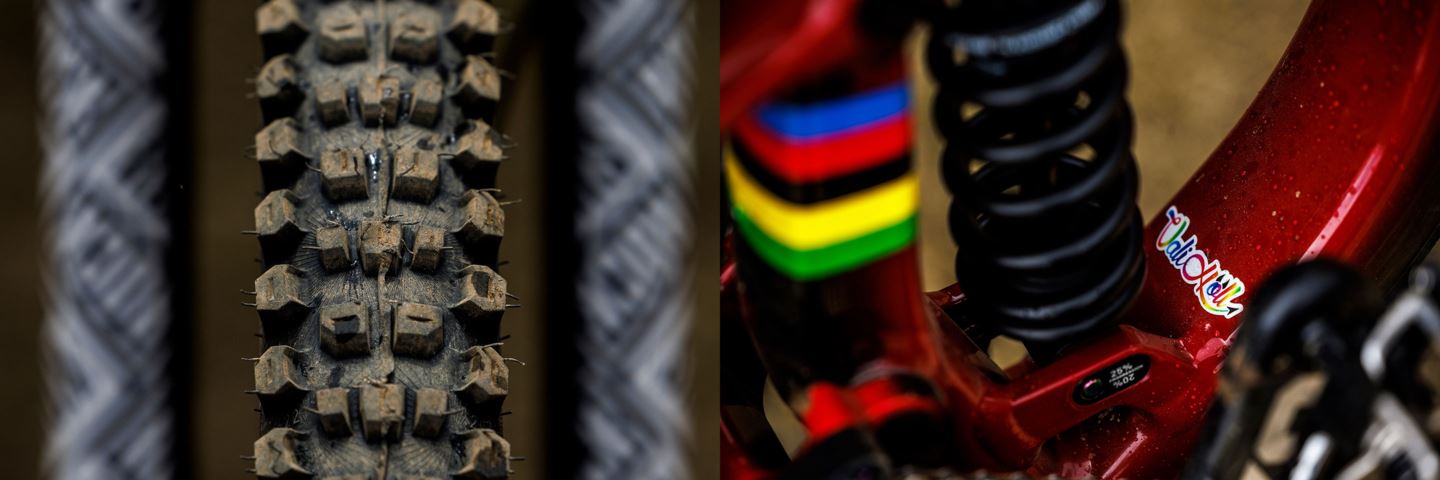 (Left) A Continental tire with the fork legs out of focus. (Right) A close-up of the seat tube and name sticker on Vali's bike.