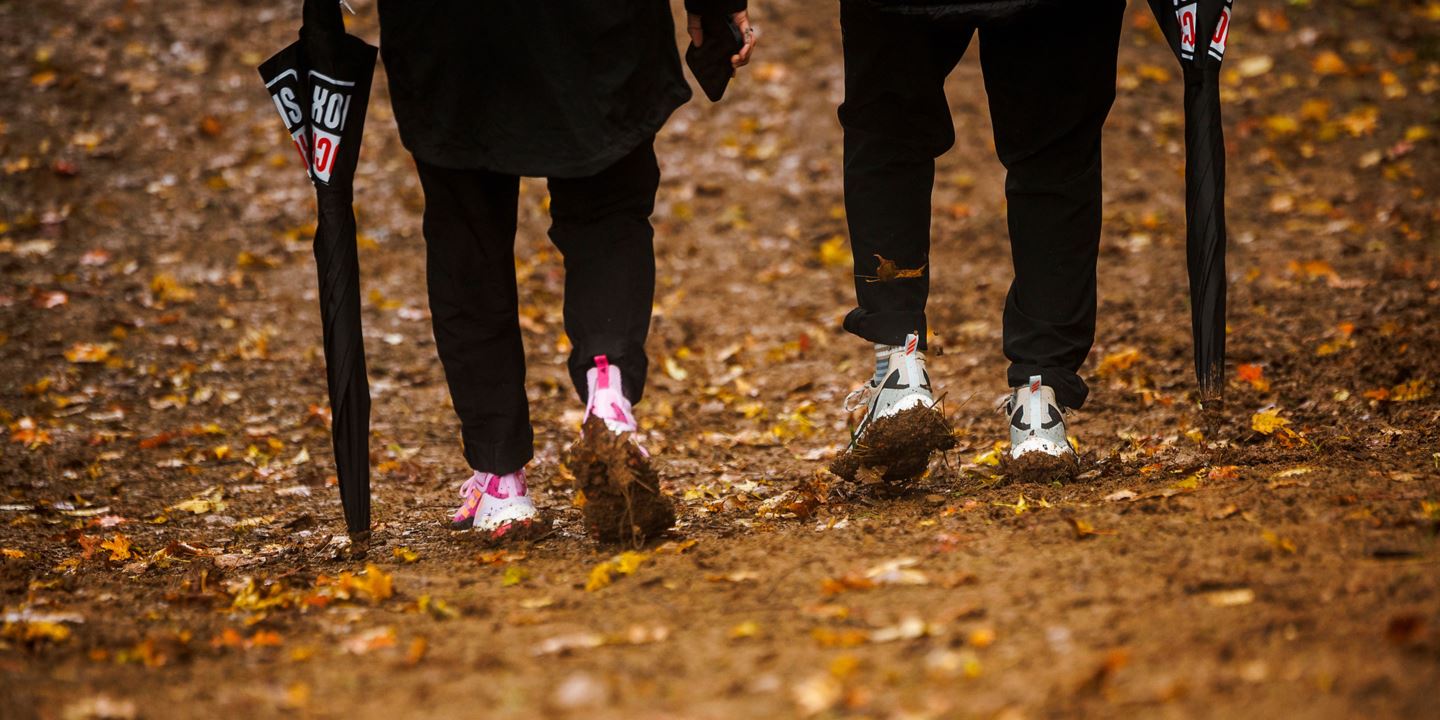 A picture of Vali Höll and Mat Gallean's muddy shoes on the track walk.