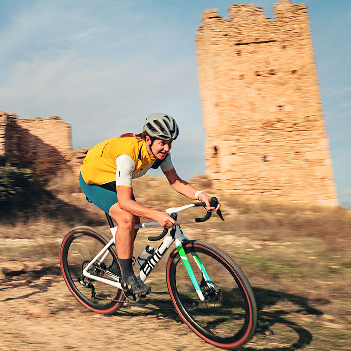 A rider descends a gravel trail on a bike with SRAM Force XPLR AXS