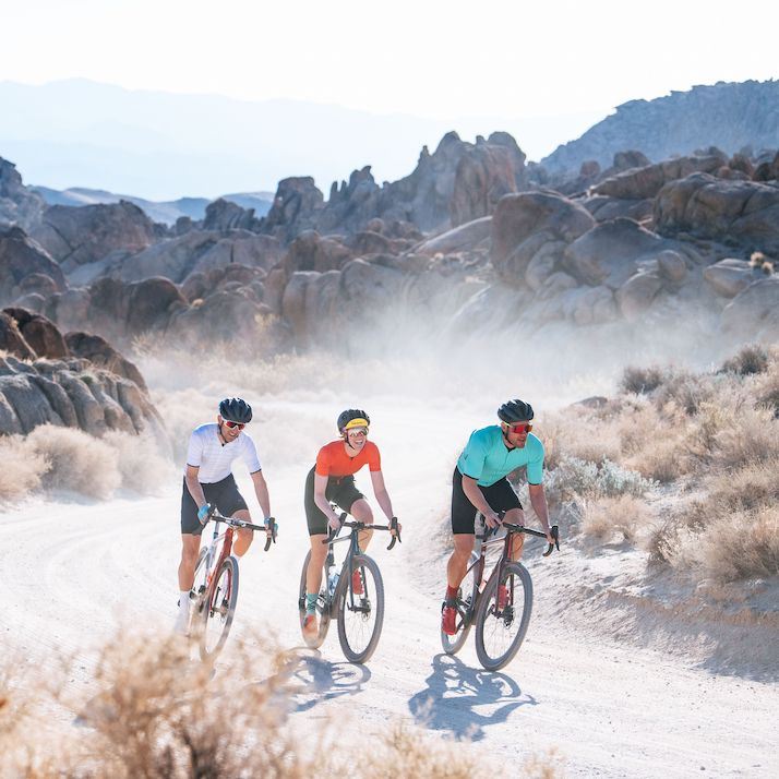 A group of riders on a gravel road